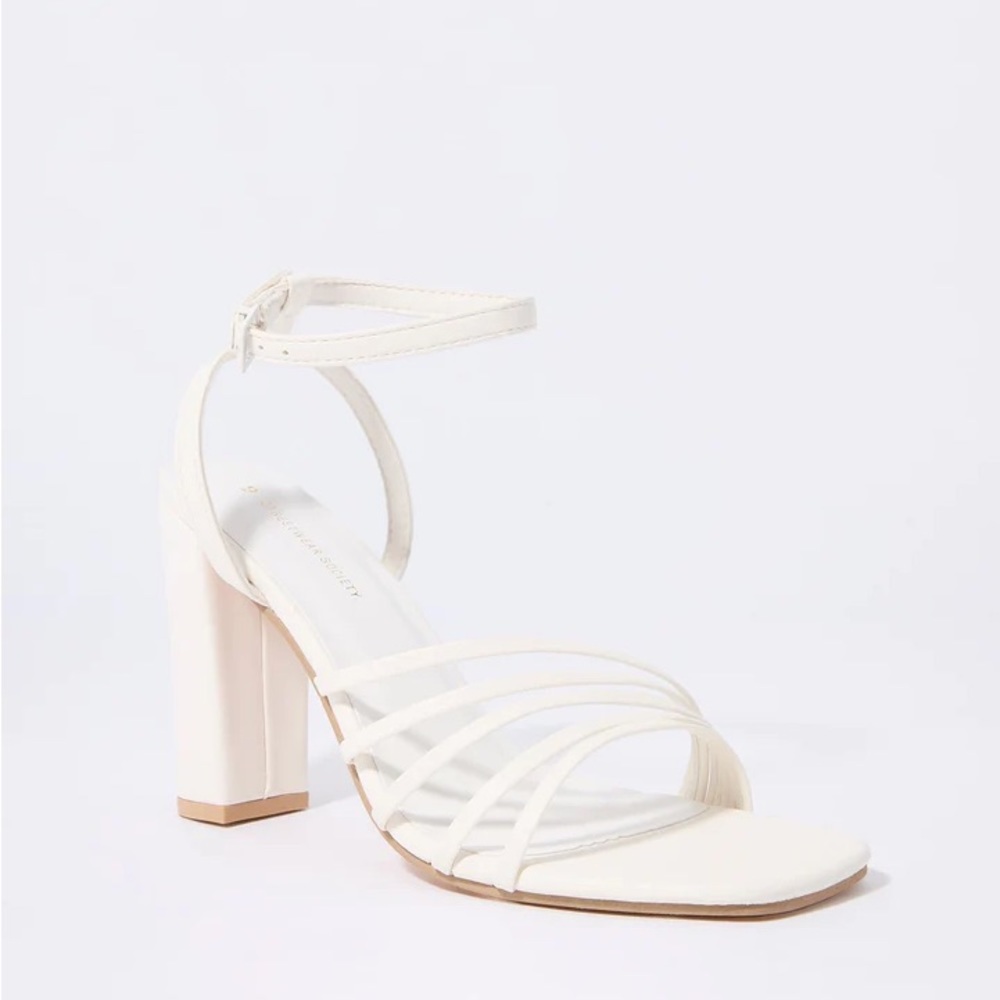 Strappy white wedge heels​